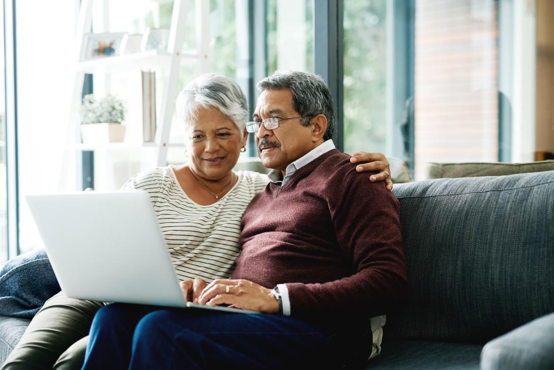 senior couple and laptop